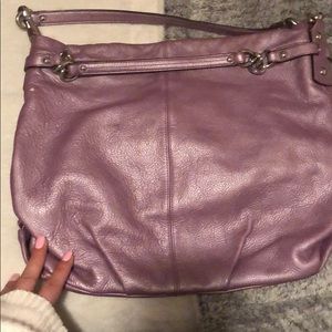 Bundle of authentic used coach bags.